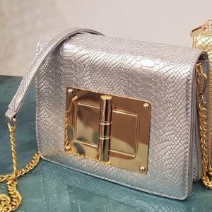 Silver and Gold python print shoulder bag w/Gold plate and cross body strap.